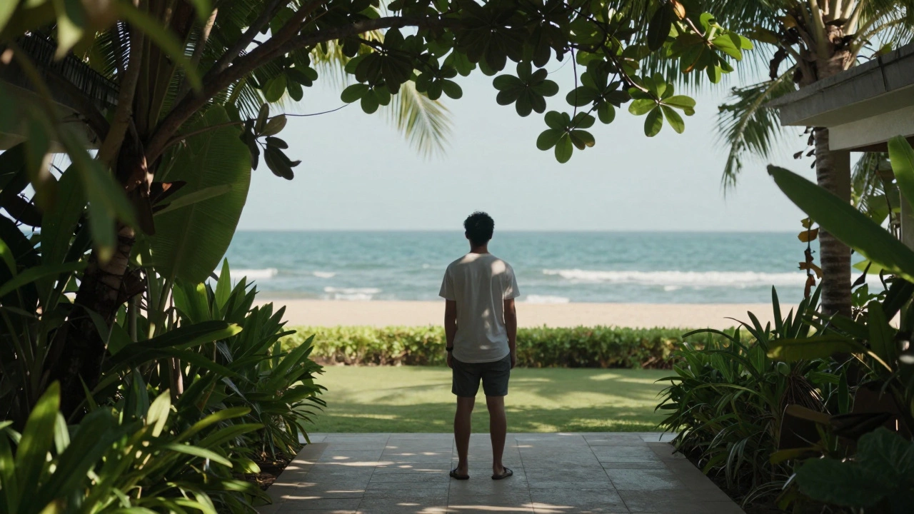 Traveler enjoying quiet garden view of ocean from nearby hotel patio